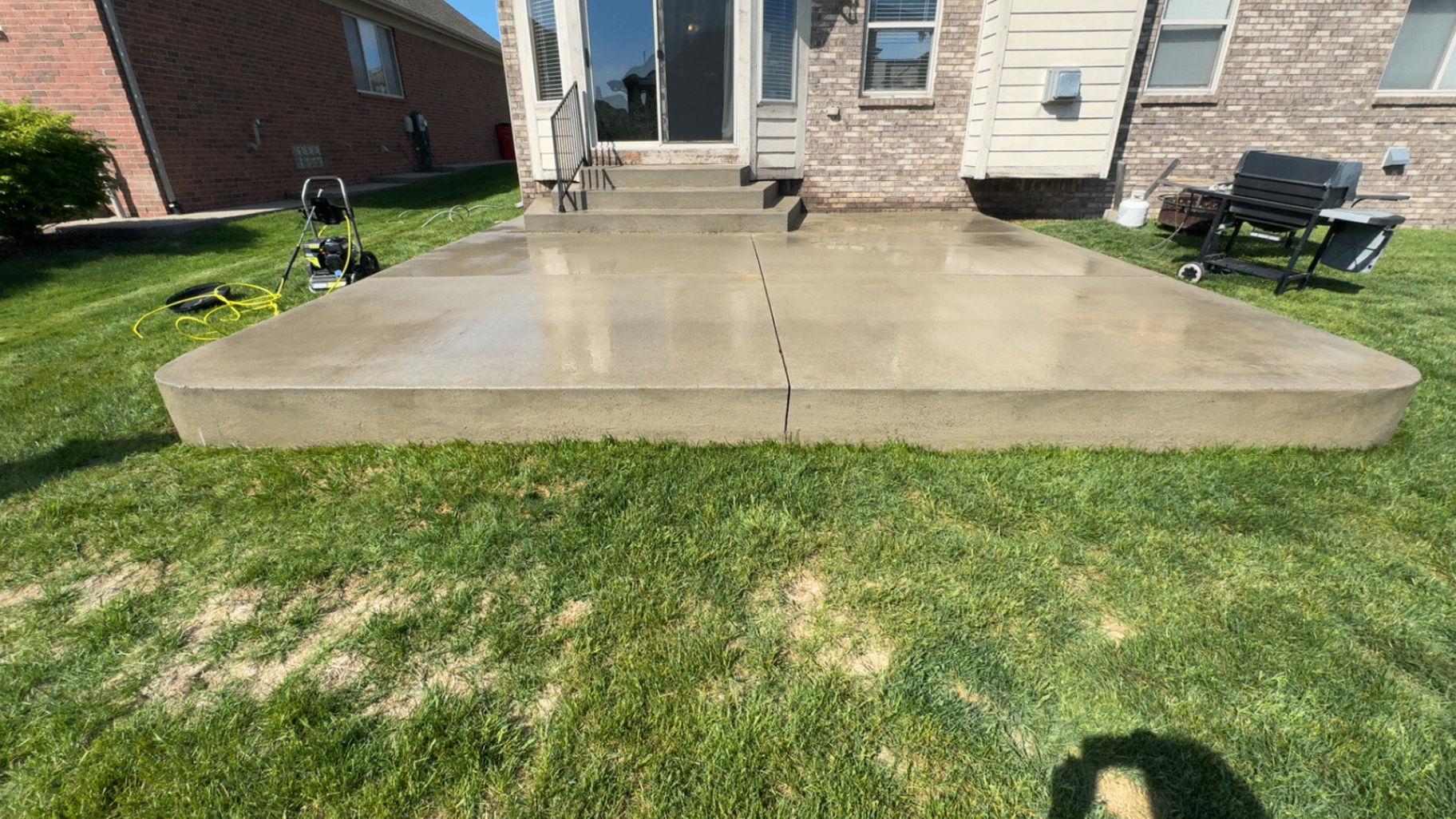 After: Concrete patio in Macomb County · Soft wash · Same day